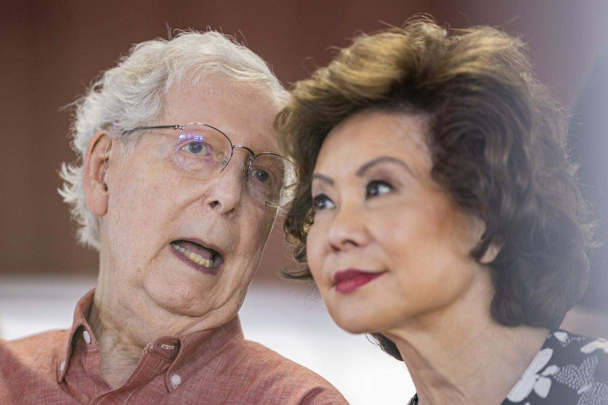 Mitch McConnell whispers to his wife Elaine Chao during Fancy Farm Picnic on Saturday, Aug. 2, 2025, at St. Jerome Church in Fancy Farm, Ky.