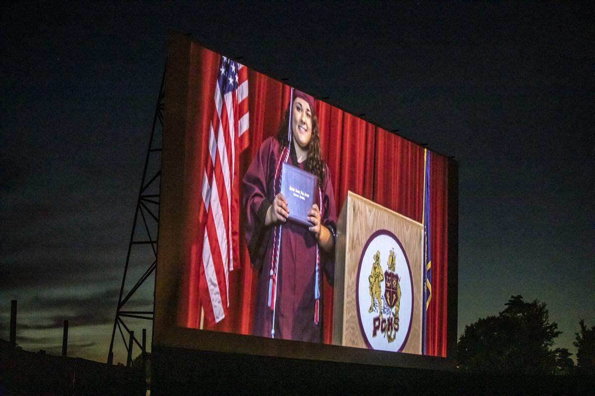 Courteney BriAnna Carter, a Pulaski County High School 2020 graduate, is shown on the 27 Twin Drive-in Theater’s screen May 30 during the school’s drive-in graduation.