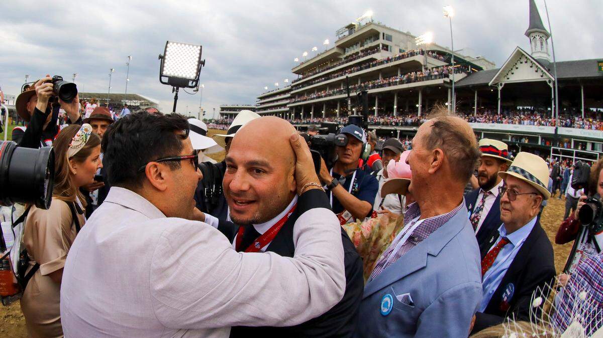 Part-owner Ramiro Restrepo, center, celebrates after Mage wins the 149th running of the Kentucky Derby at Churchill Downs. “The emotions are just through the roof, obviously,” Restrepo said afterward.