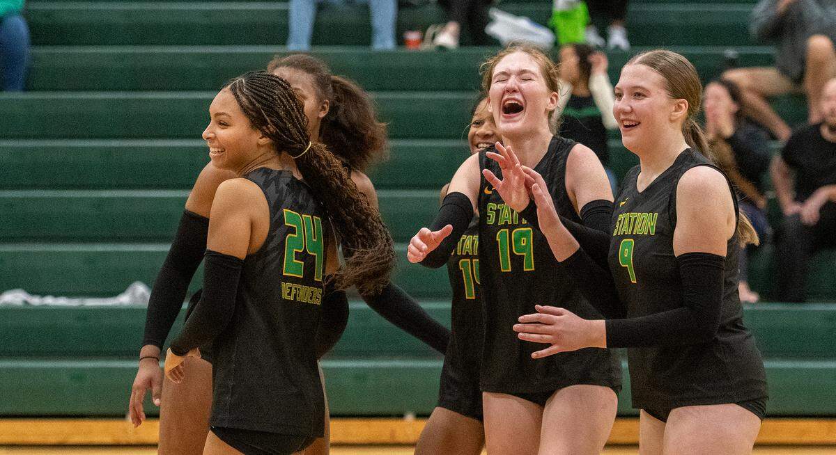 Bryan Station players celebrated after forcing a fifth set against visiting Tates Creek. The Defenders went on to win the match 3-1 at Bryan Station High School on Tuesday.
