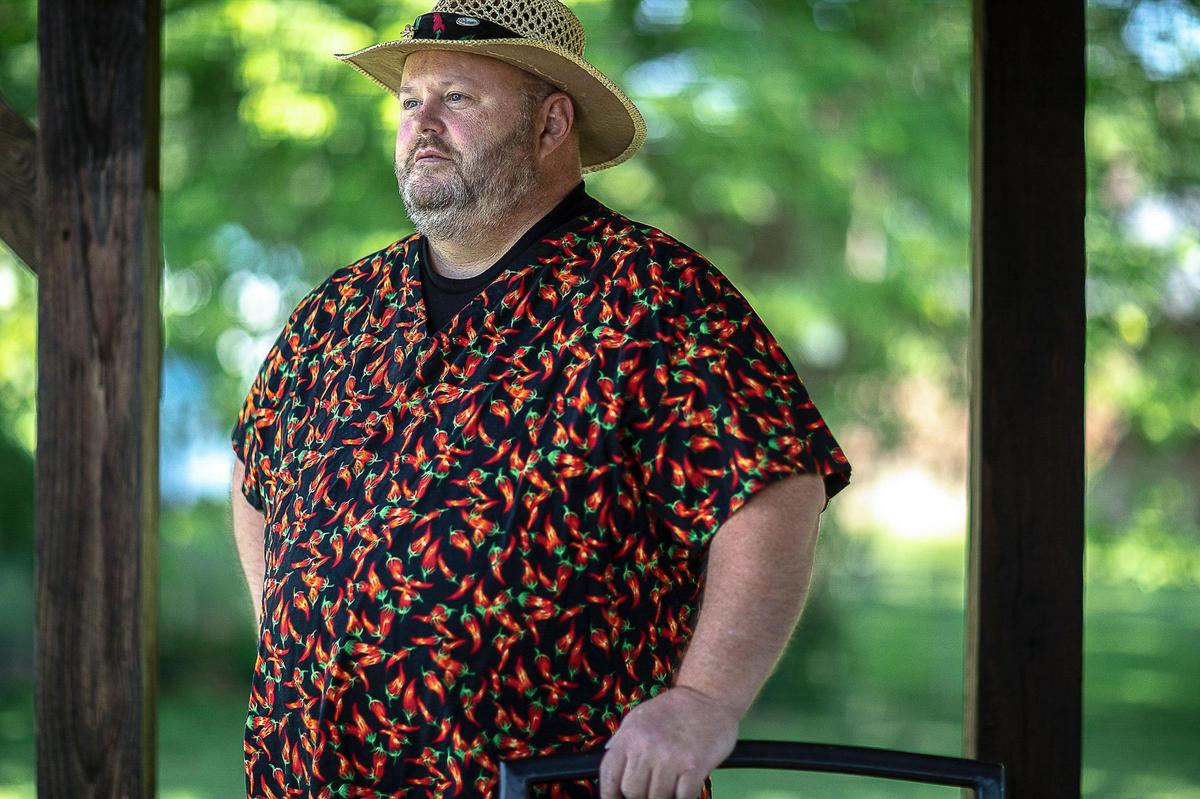 Stacy Hicks, Back Porch Hot Sauce owner, poses for a portrait on the back porch of his home in Winchester, Ky., on Friday, June 26, 2020.