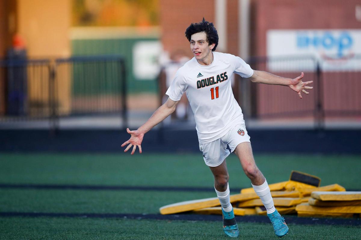 Frederick Douglass’ Gavin Jones (11) celebrates scoring a goal against Lexington Catholic during the boys’ 11th Region semifinals at Madison Central High School.