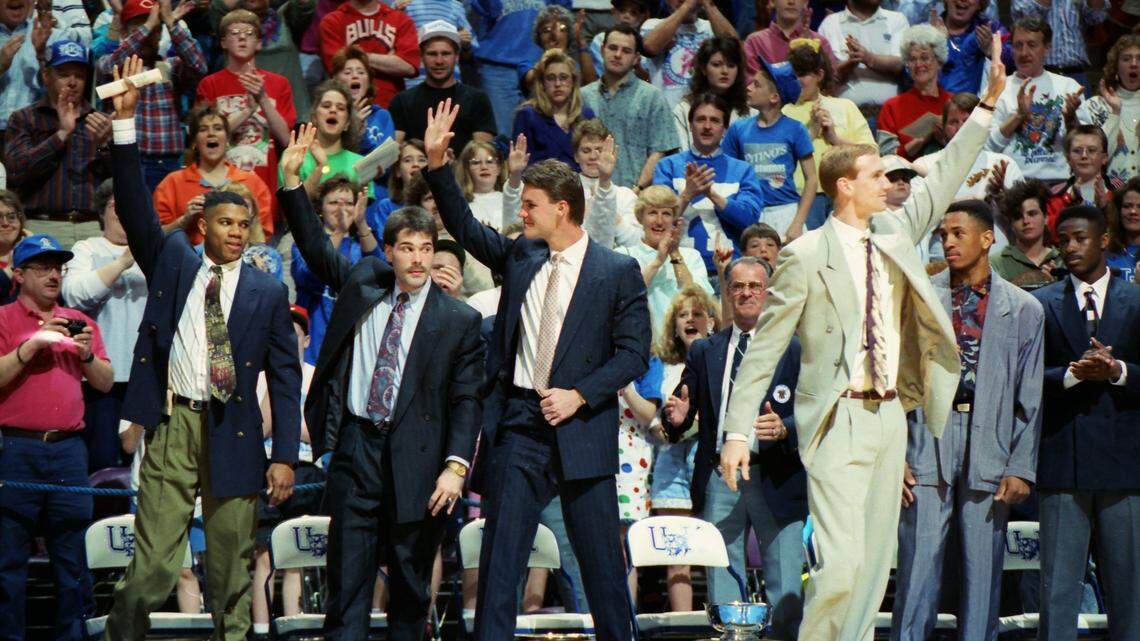 On April 7, 1992, University of Kentucky Athletics Director C.M. Newton surprised UK’s senior basketball players, from left, Sean Woods,  Richie Farmer, Deron Feldhaus and John Pelphrey by retiring their jerseys in Rupp Arena.
