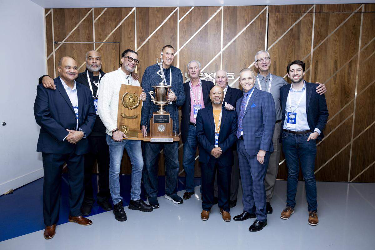 Kentucky’s 1983-84 team, which advanced to the Final Four that season, was honored during the Wildcats’ game against Georgia last weekend. From left: Paul Andrews, Winston Bennett, Kenny Walker, Sam Bowie, Jim Master, Leroy Byrd, assistant coach Jim Hatfield, Dr. Rob Davenport, Tom Heitz and Ben Bearup, son of the late Bret Bearup.