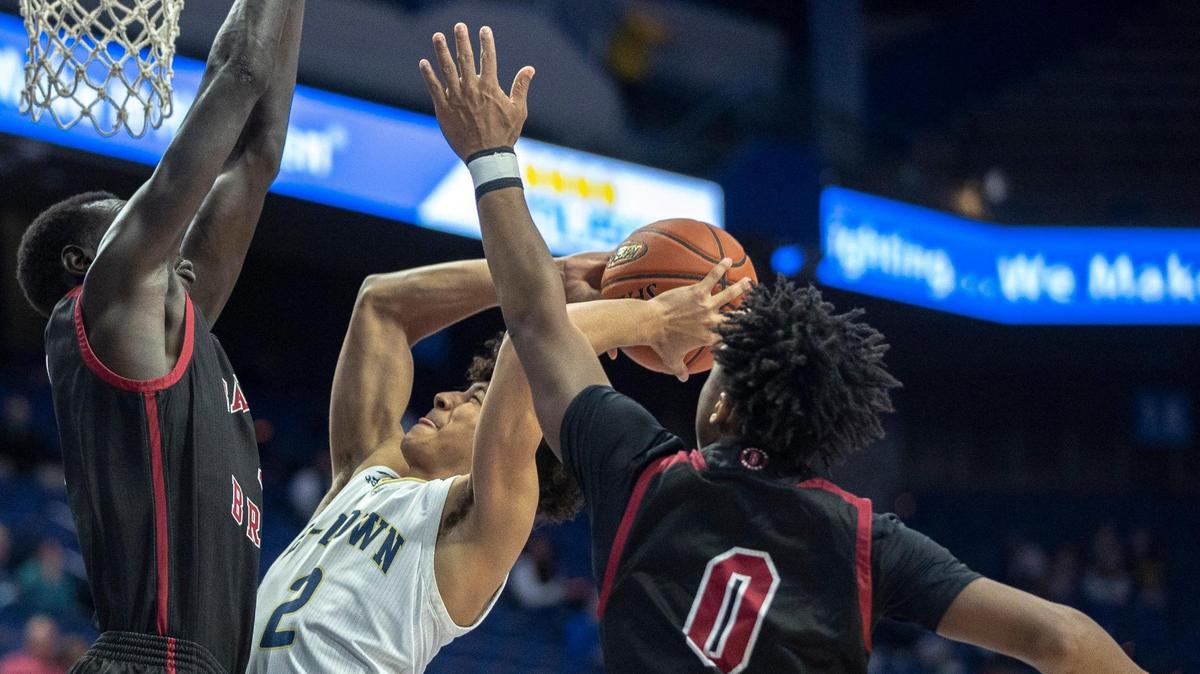 Ballard’s Maker Bar (left, protecting the rim) averaged 14.6 points, 10.9 rebounds, 3.0 assists, 2.5 blocks and 1.7 steals last season as a junior. The 6-foot-10, 190-pound big man is ranked as the top college prospect in Kentucky, regardless of class, by recruiting analyst Rick Bolus.