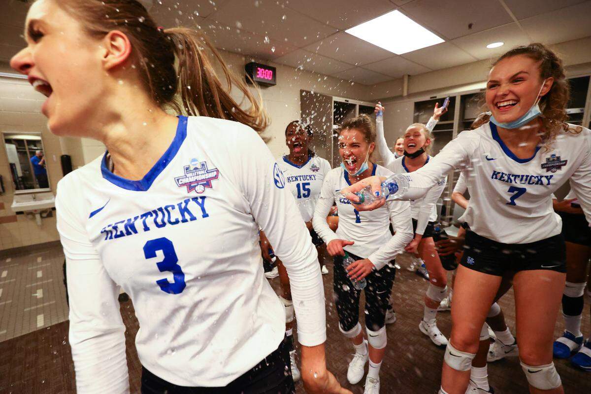 Kentucky players celebrate in the locker room after defeating Washington to advance to Saturday’s NCAA championship game.