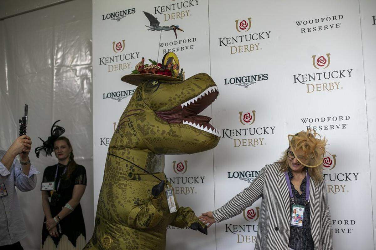 A T-Rex takes the red carpet at Churchill Downs in Louisville, Ky., Saturday, May 7, 2022.