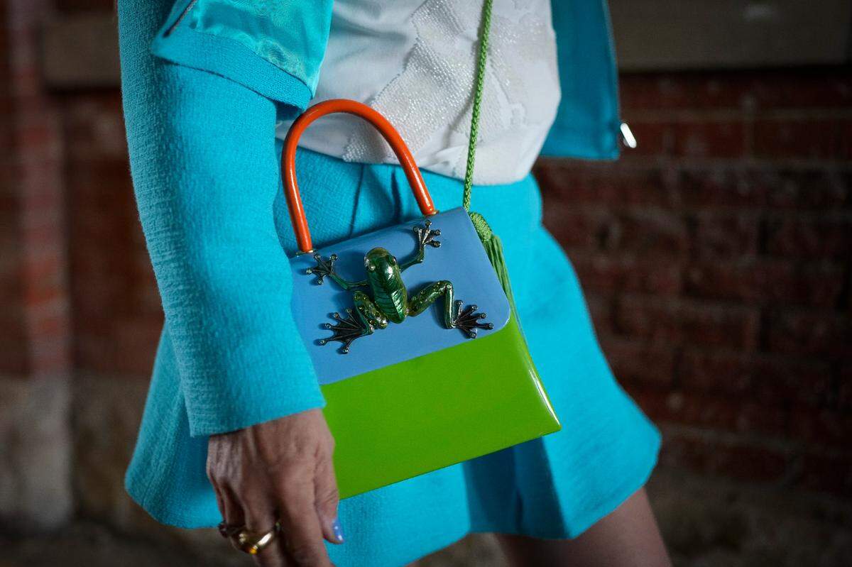 A woman walks to her seat on the day of the 149th running of the Kentucky Derby at Churchill Downs Saturday, May 6, 2023, in Louisville, Ky. (For the Herald Leader/Bryan Woolston)