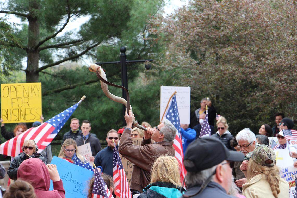 Protesters gathered outside the Kentucky Capitol during Gov. Andy Beshear’s 5 p.m. coronavirus update to speak against the Demcoratic governor’s orders that closed all non-essential businesses to slow the spread of COVID-19.