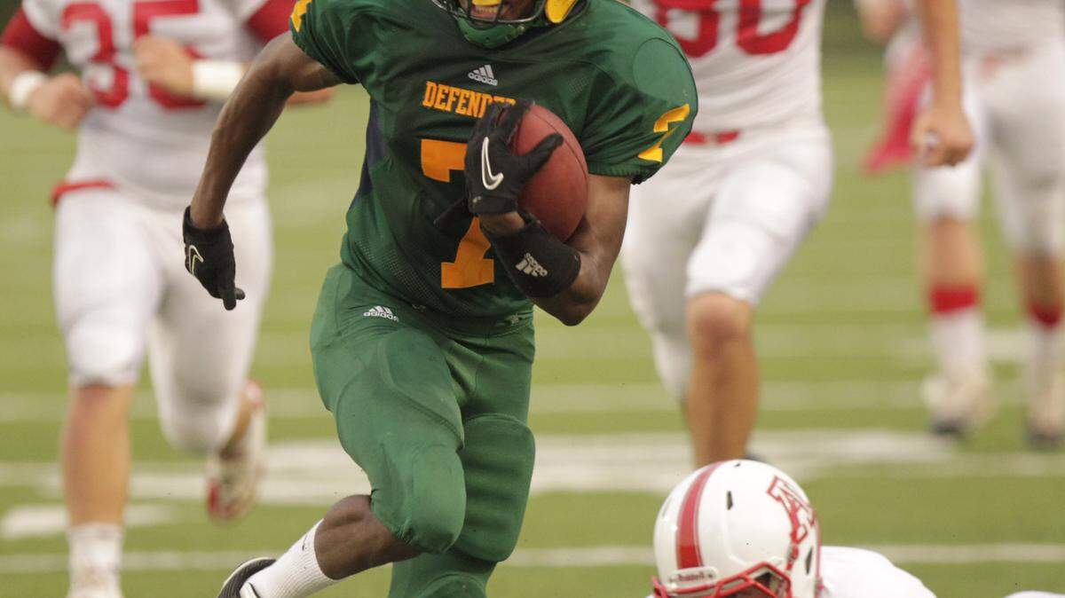 Bryan Station's Jaysuma Webb carried the ball in the second quarter. He scored on an interception return on the last play of the first half.  