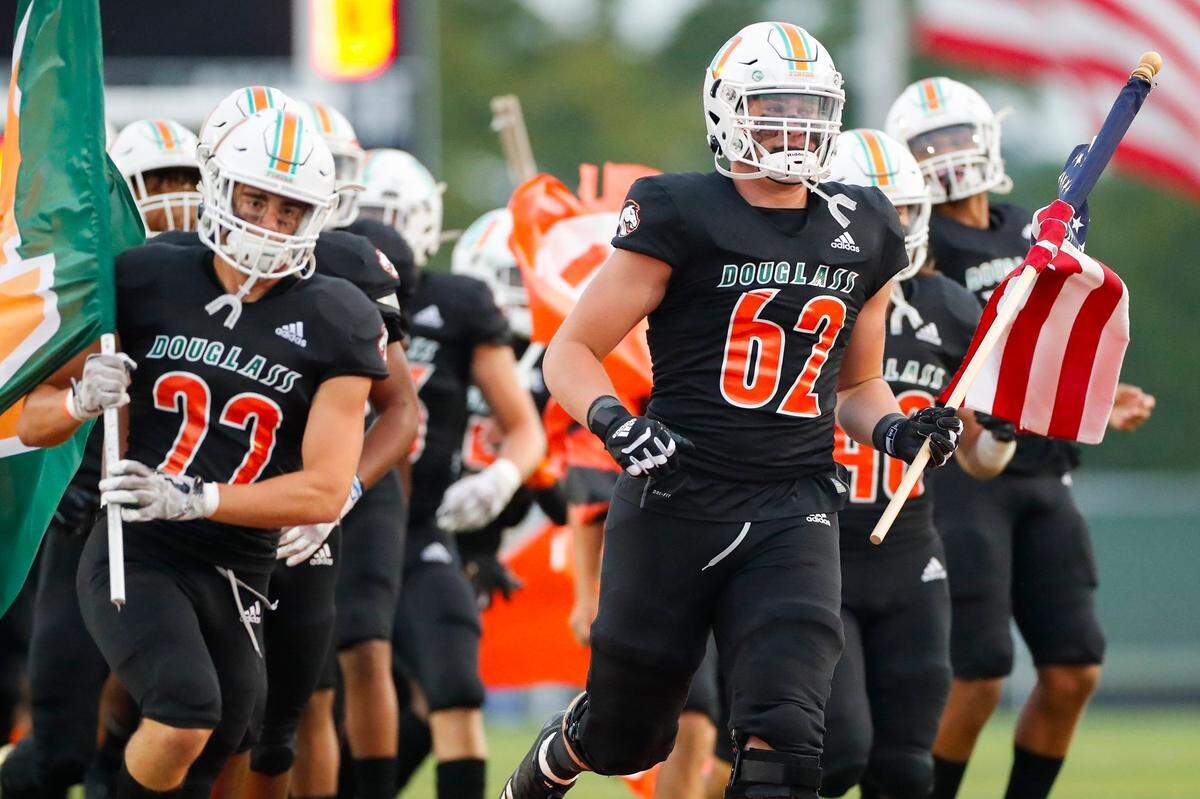 Jager Burton (62) of Frederick Douglass became the first offensive lineman to win the Paul Hornung Award in its 28-year history.