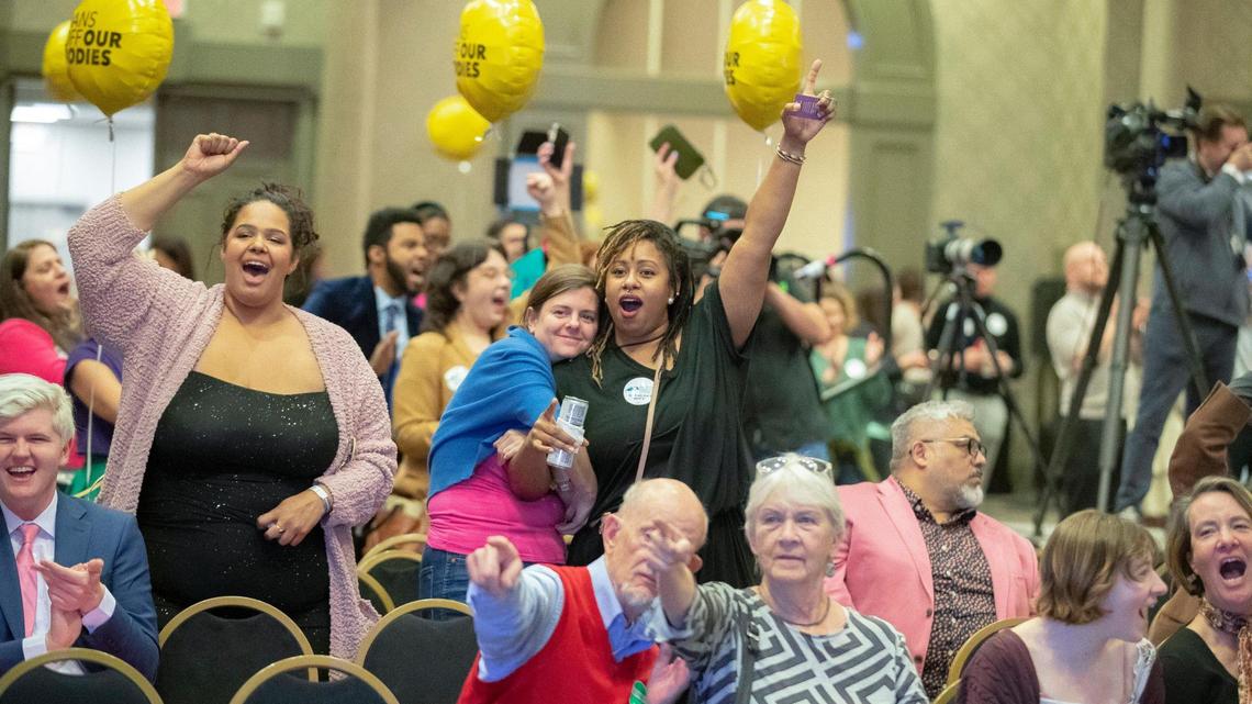 People celebrate as it’s announced on television that Kentucky Amendment 2 is likely to be defeated during a Protect Kentucky Access’ election watch party the Galt House in Louisville, Ky., on Tuesday, Nov. 8, 2022.