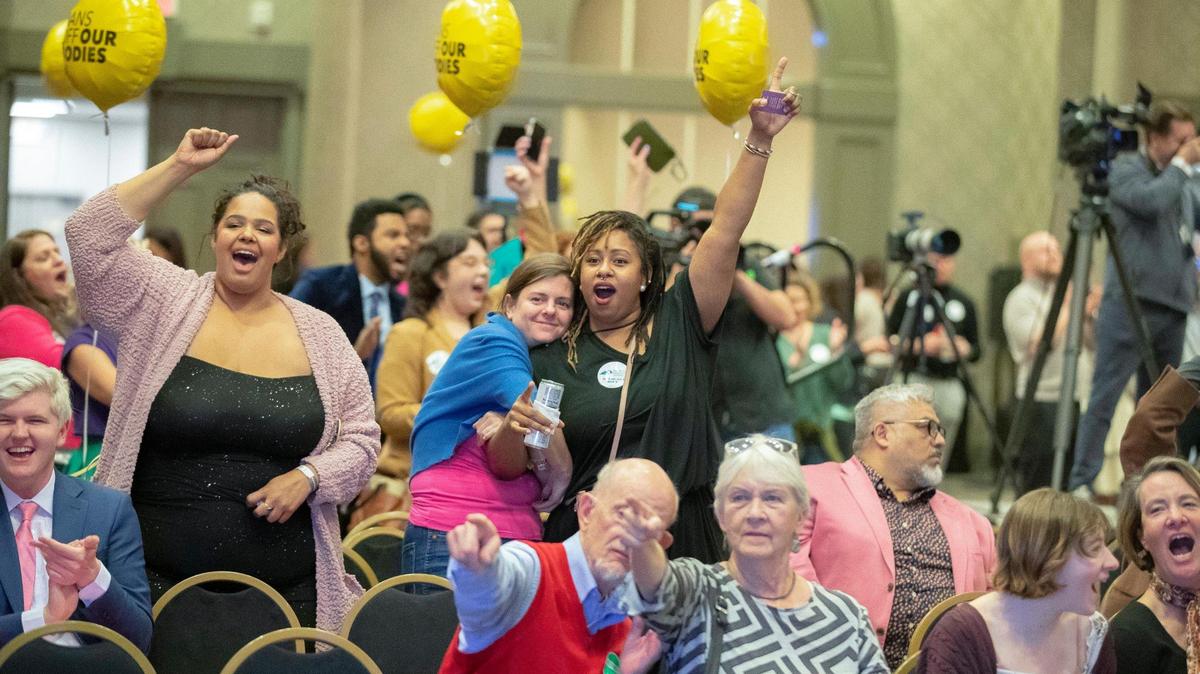 People celebrate as it’s announced on television that Kentucky Amendment 2 is likely to be defeated during a Protect Kentucky Access’ election watch party the Galt House in Louisville, Ky., on Tuesday, Nov. 8, 2022.