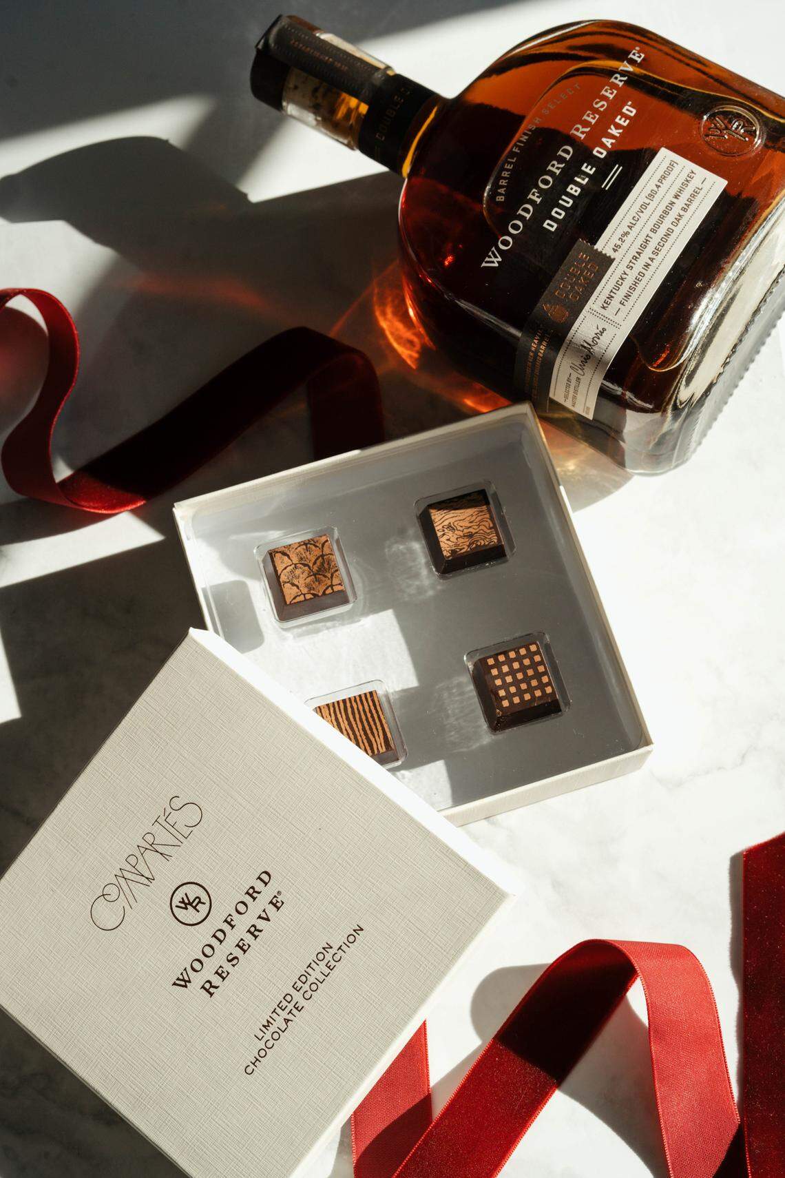 Woodford Reserve and Compartes chocolates worked together to create a box of four truffles that match specific parts of the flavor profile of Woodford Reserve Double Oaked Bourbon.