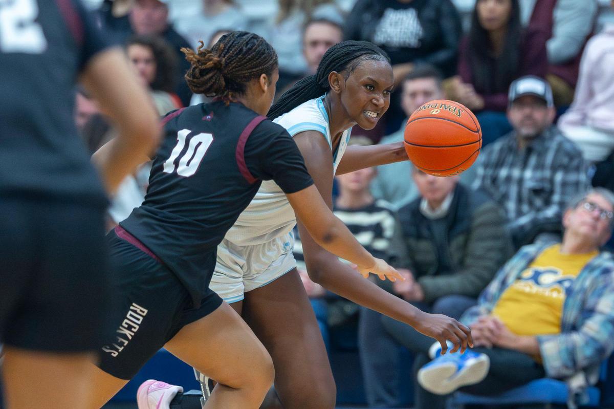 Danville Christian’s Grace Mbugua, right, moves the ball as Assumption’s Kyleigh Hall defends during Thursday’s game at Danville Christian Academy.