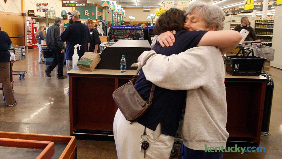 Carol Vaughan exchanges an emotional farewell with Kroger employee Kathryn Lange, left, on the final day of business at the Kroger's on Euclid Ave., which opened in 1976, in Lexington, Ky., Saturday, March 15, 2014. Vaughan has shopped at the location since it opened, and Lange has been an employee there for 24 years. Photo by Matt Goins