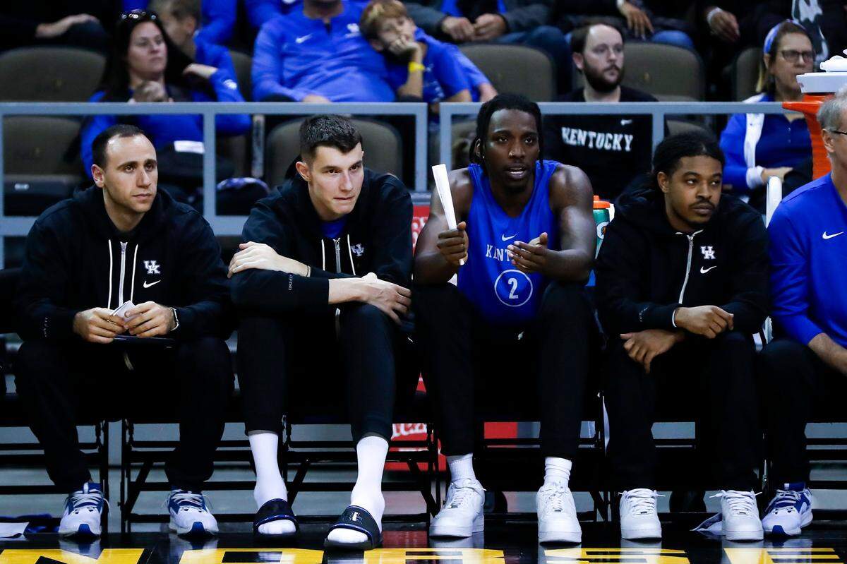 Kentucky forwards Zvonimir Ivisic and Aaron Bradshaw watch from the bench during the Blue-White Game at Truist Arena in Highland Heights.