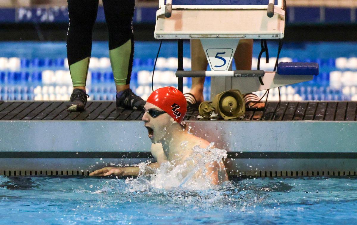 Paul Laurence Dunbar’s Alex Ochsenbein celebrates after winning the 100-yard breaststroke at the 2023 KHSAA state meet at the University of Kentucky’s Lancaster Aquatic Center Saturday. Ochsenbein broke the state meet record in the event.