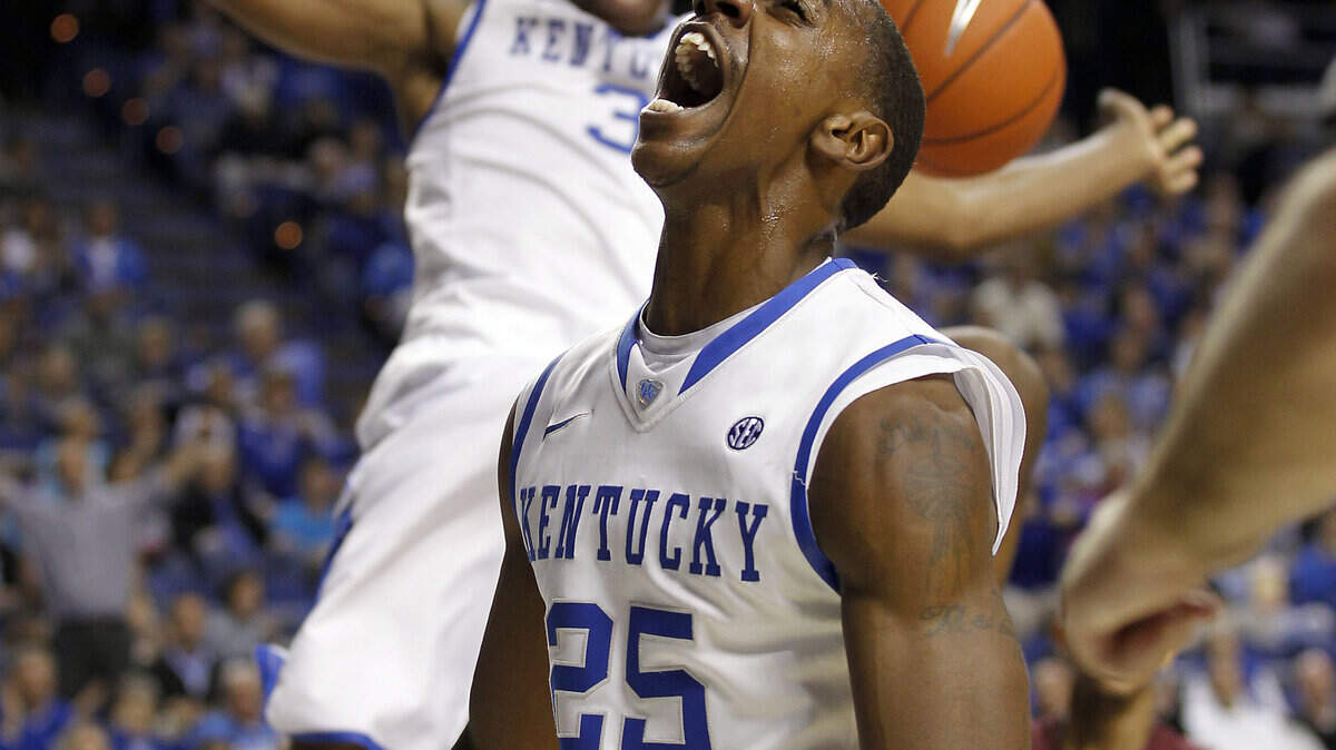 Marquis Teague roared as Terrence Jones put in one of Kentucky's ten first-half dunks. Jones finished the game with 22 points, and Teague added 12.  