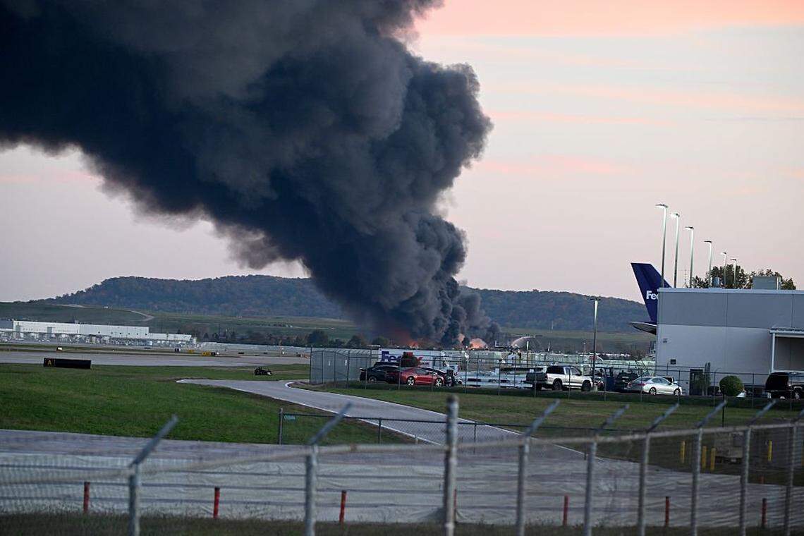 LOUISVILLE, KENTUCKY - NOVEMBER 04: Fire and smoke mark where a UPS cargo plane crashed near Louisville Muhammad Ali International Airport on November 04, 2025 in Louisville, Kentucky. The fully fueled plane crashed shortly after takeoff with a shelter-in-place order issued for within 5 miles of the airport. (Photo by Stephen Cohen/Getty Images)