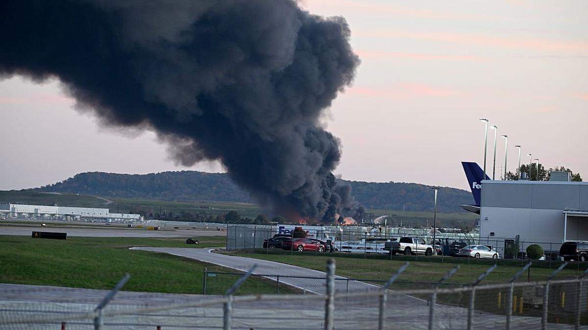 LOUISVILLE, KENTUCKY - NOVEMBER 04: Fire and smoke mark where a UPS cargo plane crashed near Louisville Muhammad Ali International Airport on November 04, 2025 in Louisville, Kentucky. The fully fueled plane crashed shortly after takeoff with a shelter-in-place order issued for within 5 miles of the airport. (Photo by Stephen Cohen/Getty Images)