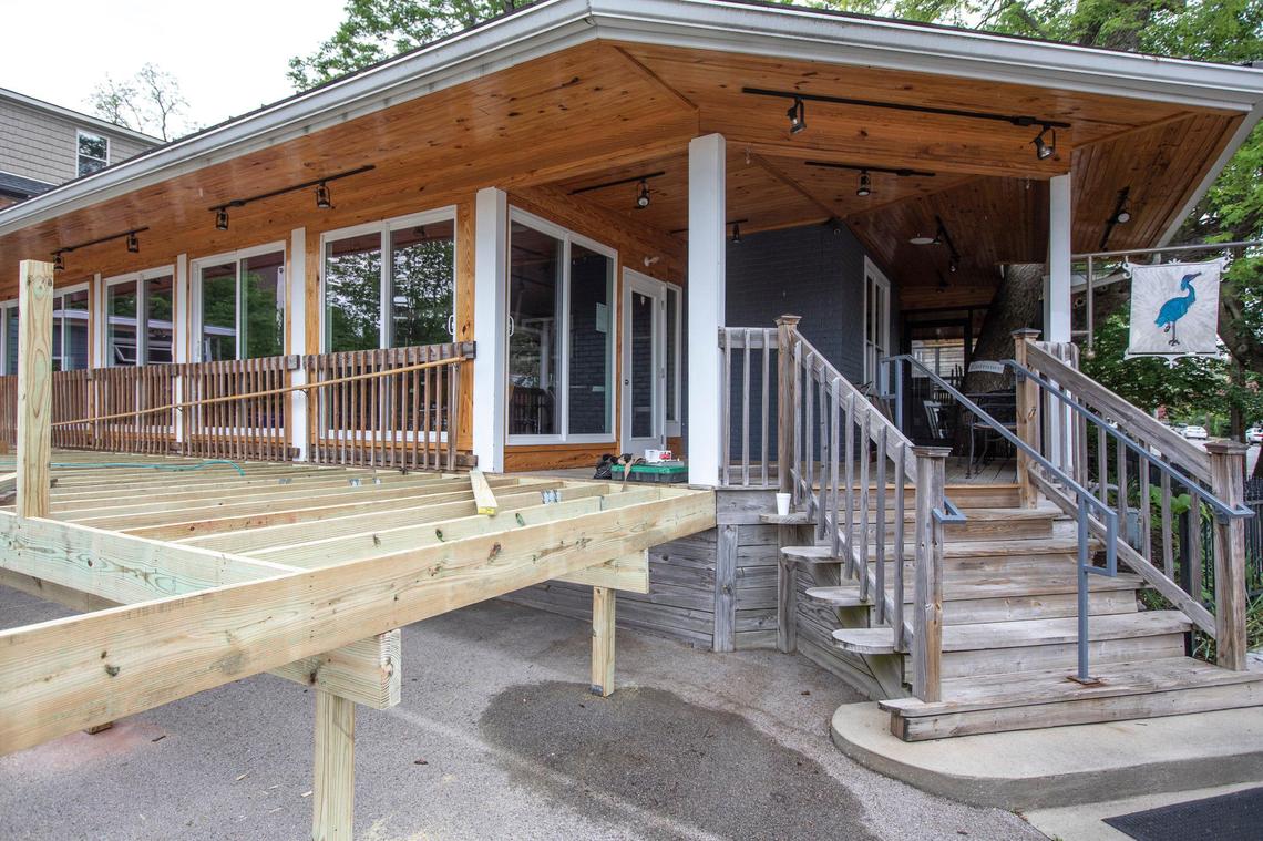A deck under construction Monday outside Lexington’s Blue Heron Steakhouse at 185 Jefferson St. The deck will be used to allow for more outside dining space once the restaurant reopens to in-person dining Friday.
