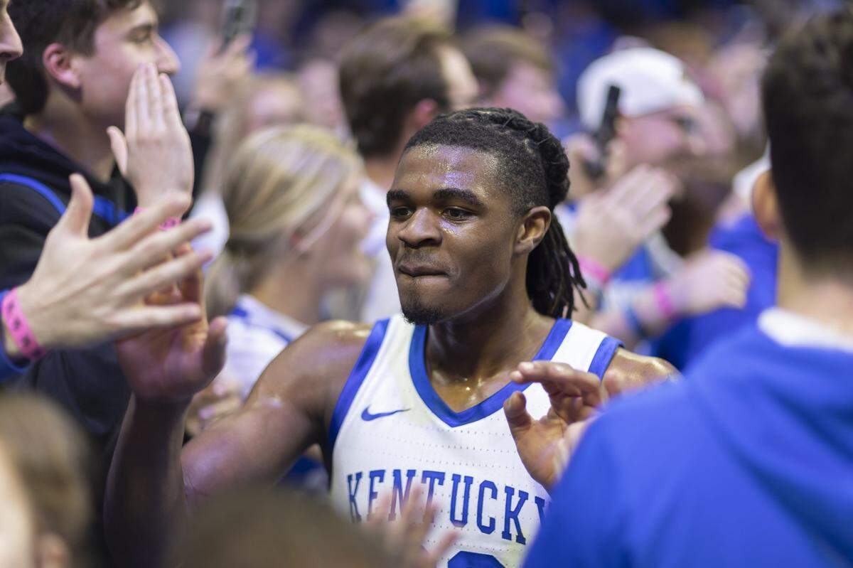 Kentucky guard Otega Oweh greets fans following a win against Tennessee at Rupp Arena on Feb. 11.