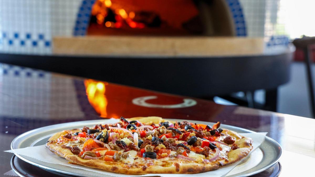 The Meat Lover’s Mediterranean pizza (10-inch $19; 14-inch $27; calzone $19) at Black-Type Brewing is topped with mozzarella, crumbled feta, chorizo, Italian sausage, sun-dried tomatoes, red peppers, black olives, minced garlic, red onions and finished with fresh basil.