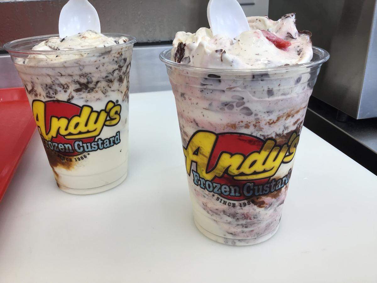 Two of the most popular items from Andy’s Frozen Custard, the BootDaddy Concrete, left, with vanilla custard blended with Oreos, caramel and hot fudge, and the Snowmonster Concrete, right, vanilla custard blended with strawberries and melted chocolate chips.