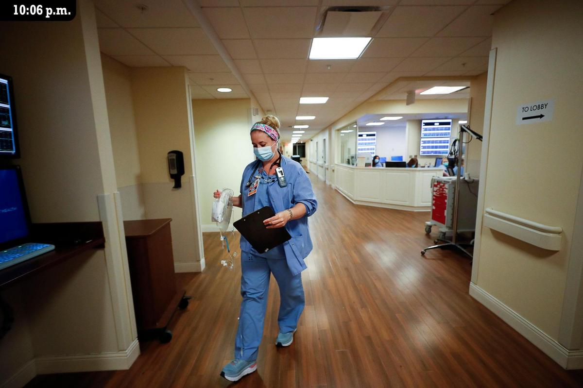 Cydney Kanis, a charge nurse at Baptist Health hospital, works to admit a new mother in the maternity unit Friday, July 9. Kanis is one of about ten nurses working the night shift in the maternity unit. Twenty-three babies were born at the hospital between 6 a.m. Friday, July 9 and 6 a.m. Saturday, July 10. “Team work is essential here,” said fellow charge nurse Susan Jackson. Several nurses are also on call at all times and will be called in if extra help is needed.