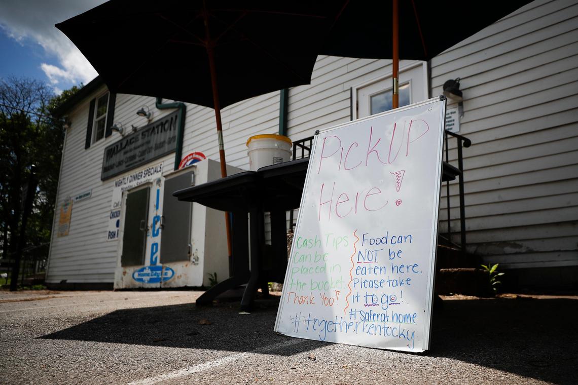 Orders are left on a non-contact to go table outside of Wallace Station.