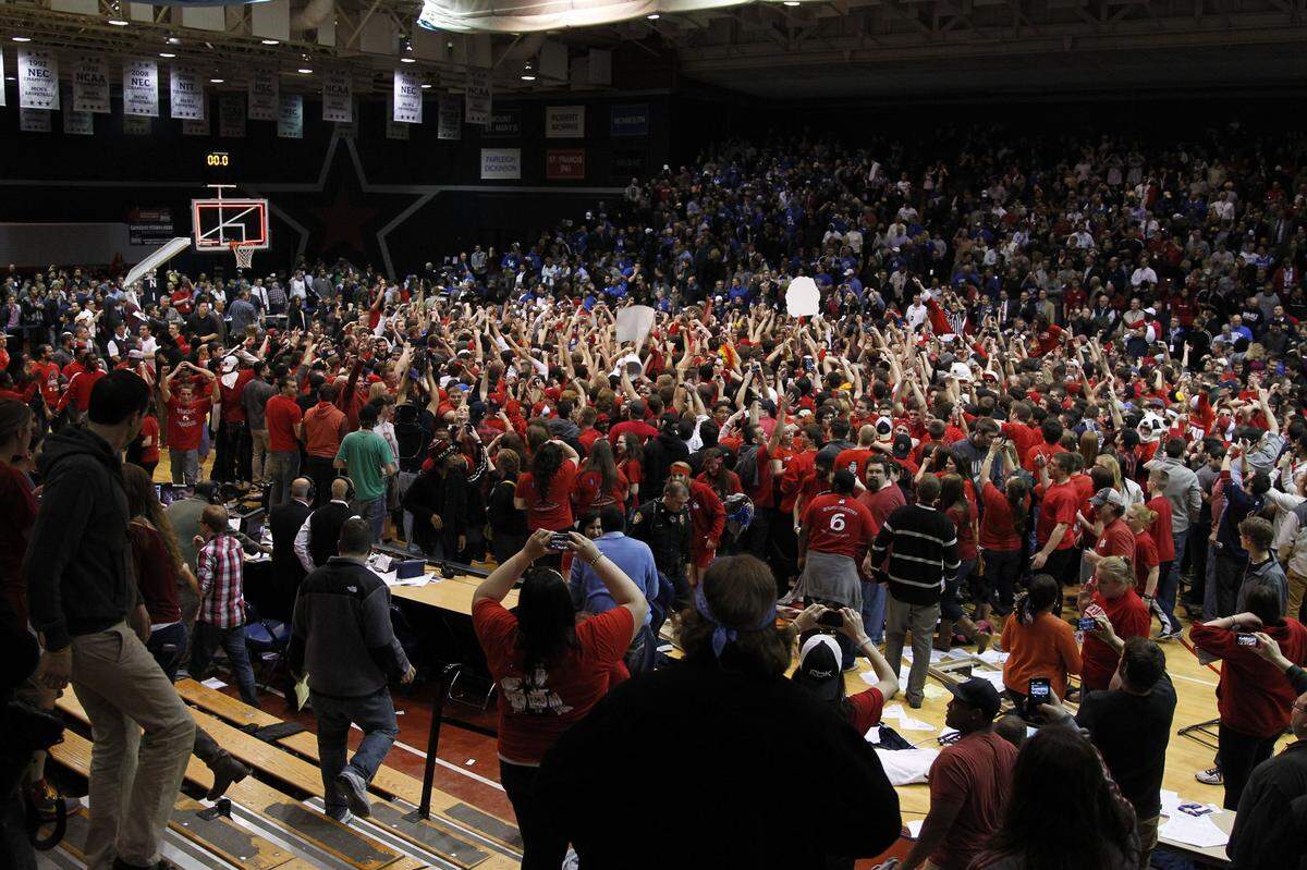 Robert Morris fans stormed the court after the Colonials upset Kentucky 59-57 in the first round of the 2013 NIT.