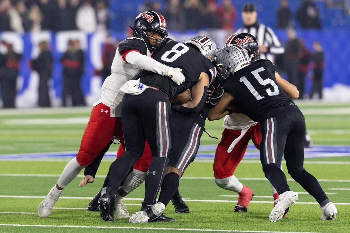 Pulaski's Kasen Brock (8) gets tackled during the Class 5A UK HealthCare Sports Medicine State Football Finals Saturday, December 6th, 2025 at Kroger Field in Lexington KY
