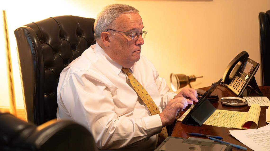 Kentucky Senate President Robert Stivers (R-Manchester) working from his law firm office, answering emails, scheduling appointments, and glancing over legislation on his iPad on May 28, 2025, in Manchester, Ky.