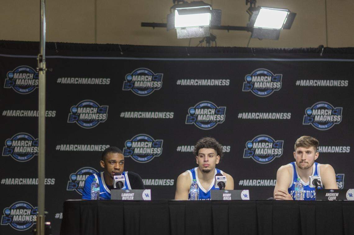 Kentucky guard Lamont Butler, left, talks to reporters during the postgame press conference following Friday’s loss to Tennessee in the Sweet 16.