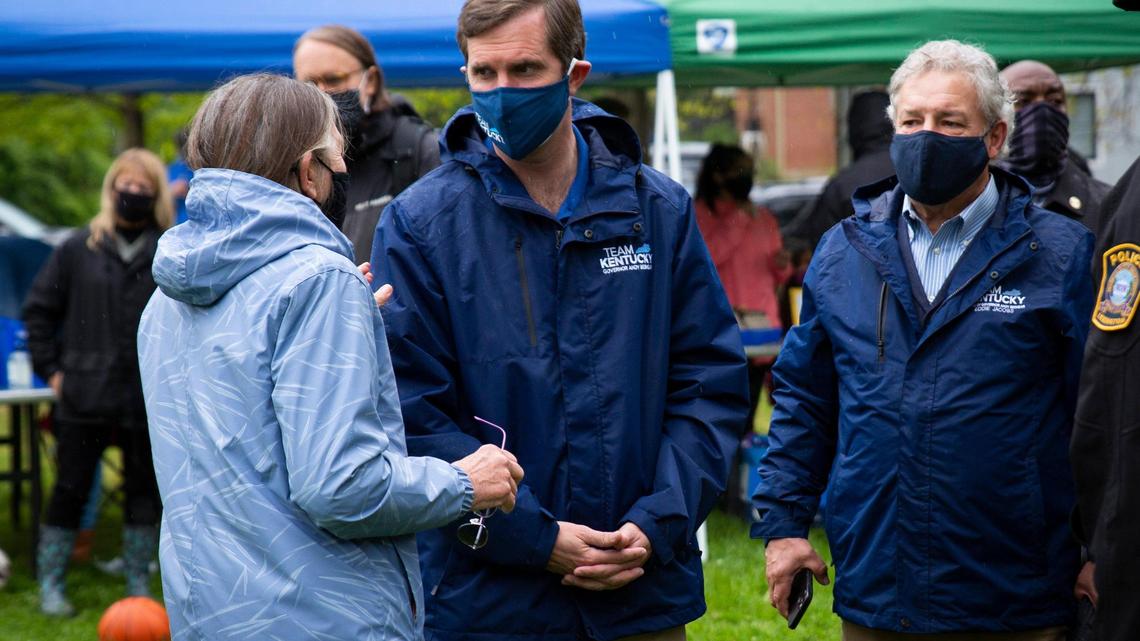Kentucky Governor Andy Beshear talks with attendees during the Peace Walk and resource fair, which aims to bring awareness to gun violence, in Lexington, Ky., on Saturday, April 24, 2021.