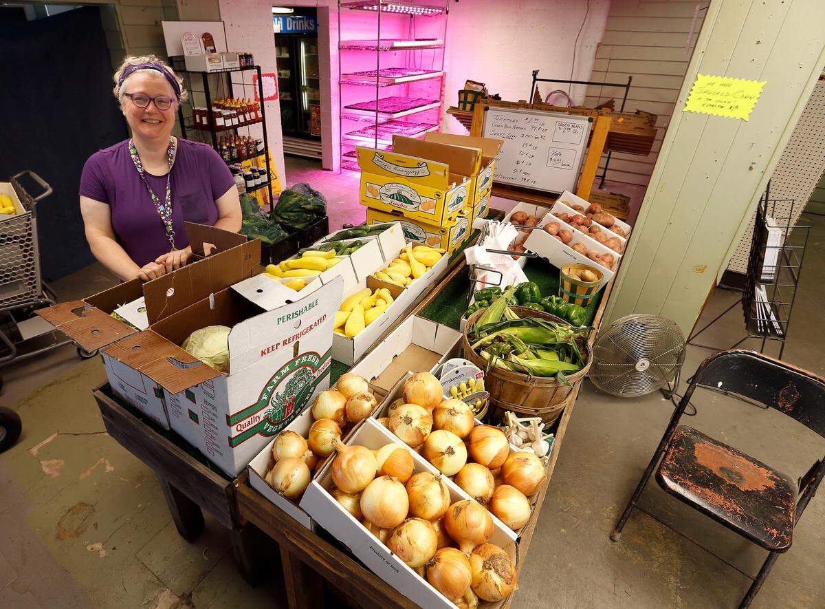 Marie Henderson in her store, Henderson’s Eclectic Emporium, formerly Judy’s Market and an old service station, at the corner of East Main St. and South Ashland Ave. in 2017.