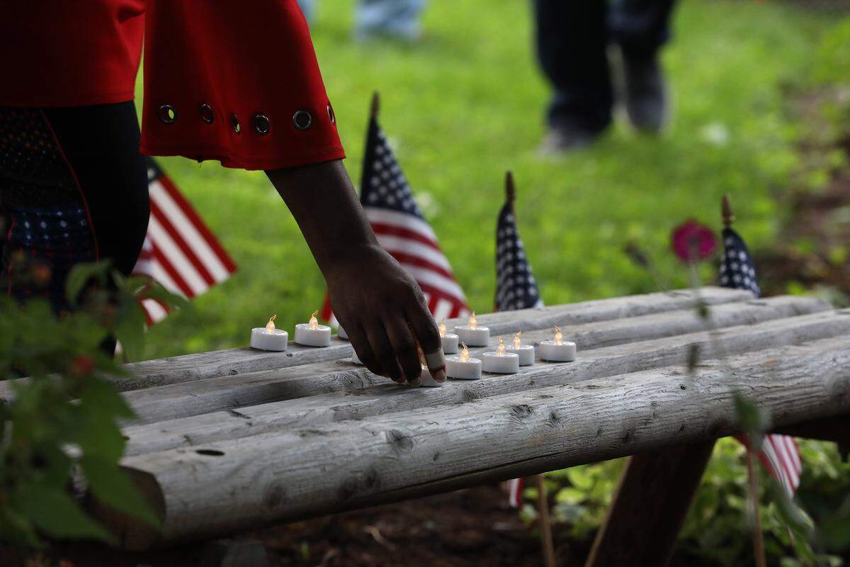 Candles were placed to remember Civil War veterans Saturday evening during the Juneteenth Jubilee at African Cemetery No. 2 on Seventh St. in Lexington. 