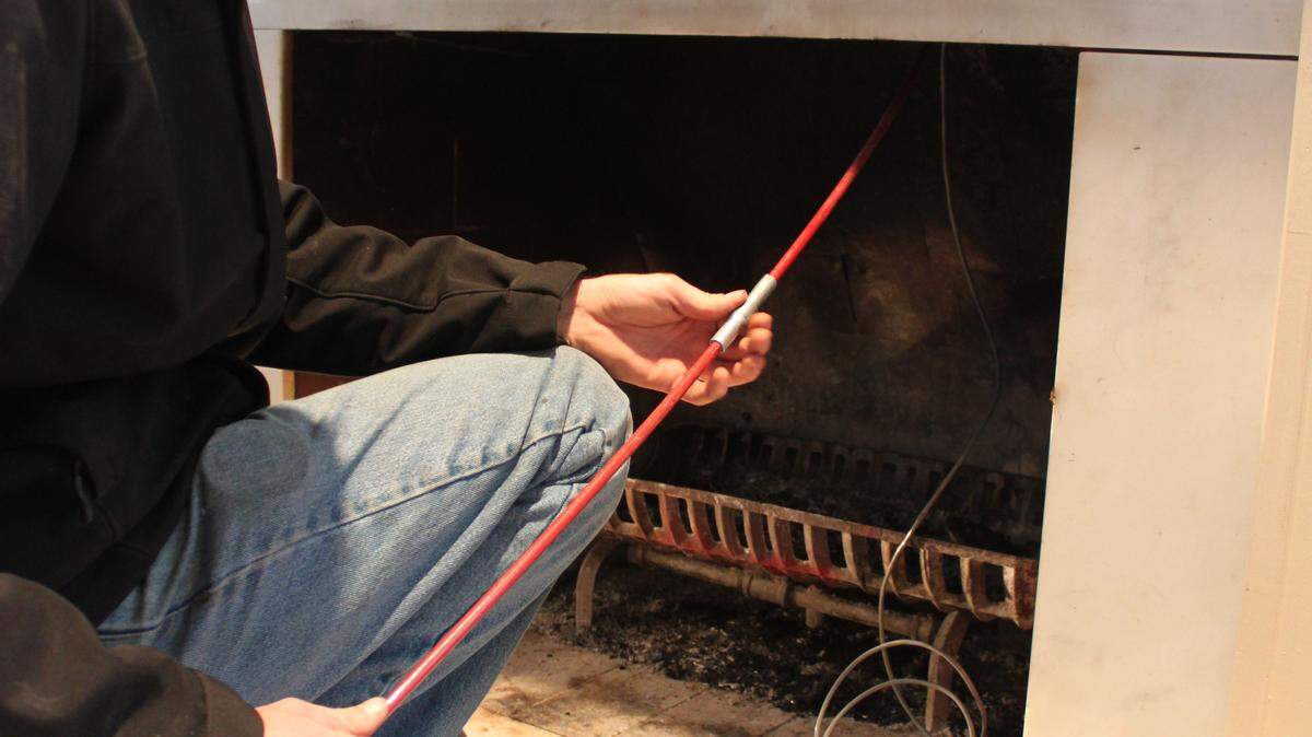 Jake Myers of Barnhill Chimney Co. examined the ChimScan video on the screen. The ChimScan allows him to examine the inside of the chimney closely without getting dirty.