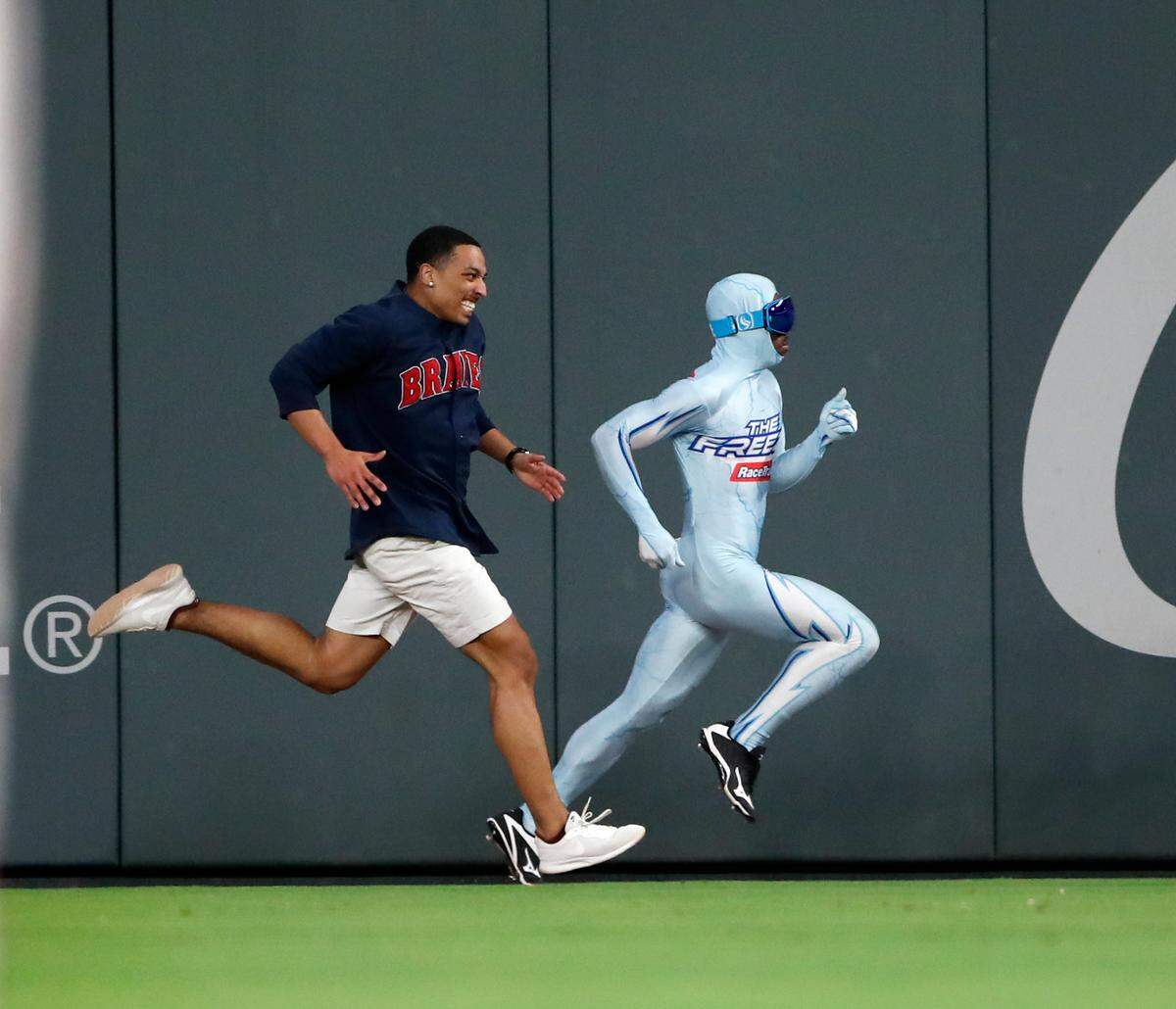 “The Freeze” wears a spandex suit and races against fans as part of a promotion during Atlanta Braves games. The man currently wearing the suit is Durran Dunn, who will be competing in the 100- and 200-meter races at this weekend’s USA Track and Field Masters Outdoor Championships in Lexington.