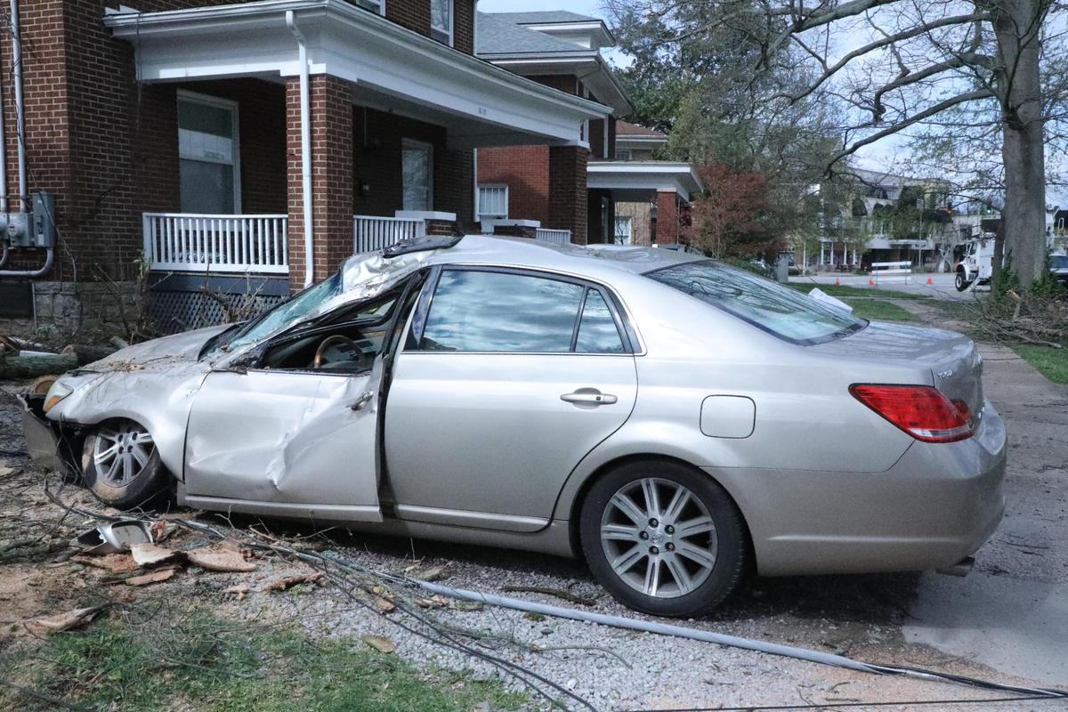 A damaged car sits in a driveway in the Chevy Chase neighborhood in Lexington on April 3, 2024.