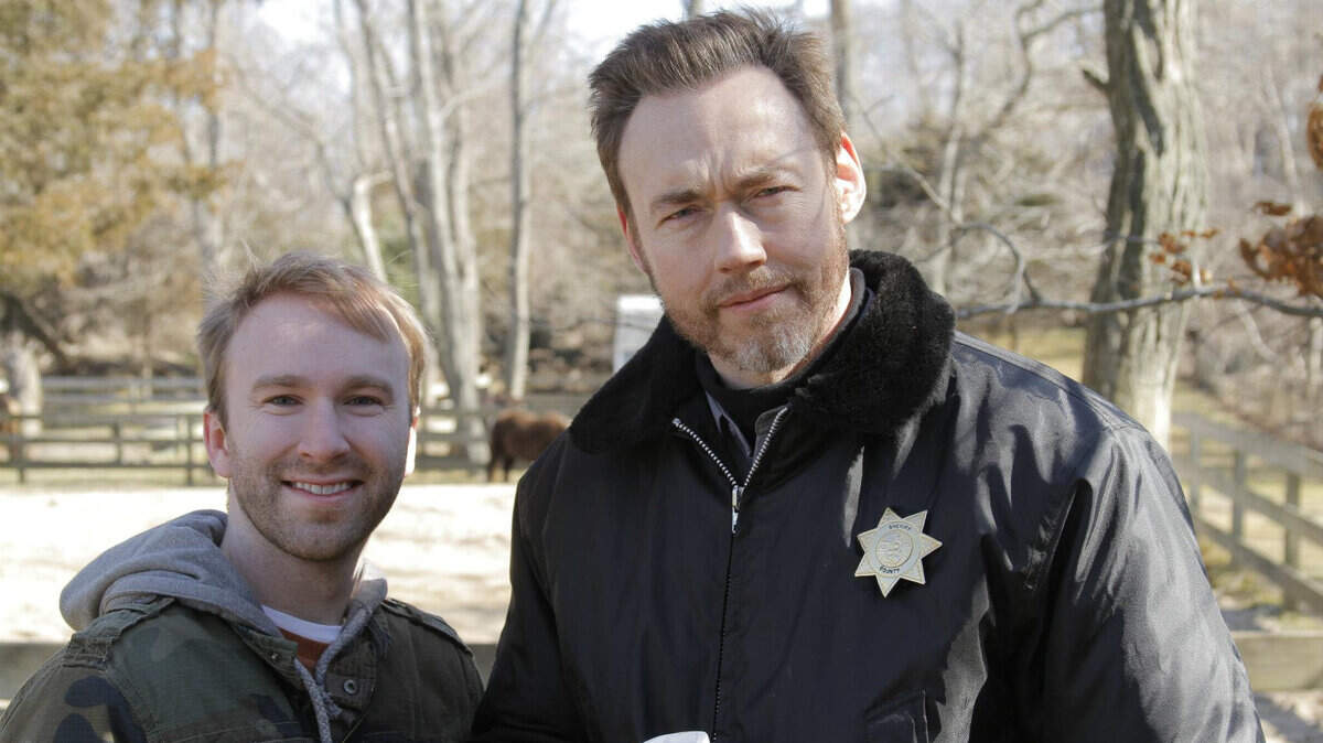 Screenwriter Tyler Hisel, left, visited with actor Kevin Durand on the set of Hisel's film Dark Was the Night.   