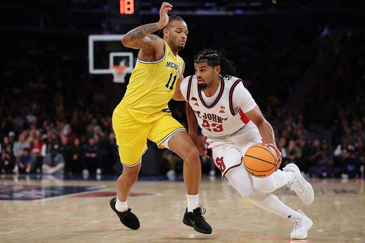 NEW YORK, NEW YORK - OCTOBER 25: Bryce Hopkins #23 of the St. John's Red Storm dribble against Roddy Gayle Jr. #11 of the Michigan Wolverines during the second half at Madison Square Garden on October 25, 2025 in New York City. The Michigan Wolverines won 96-94. (Photo by Sarah Stier/Getty Images)