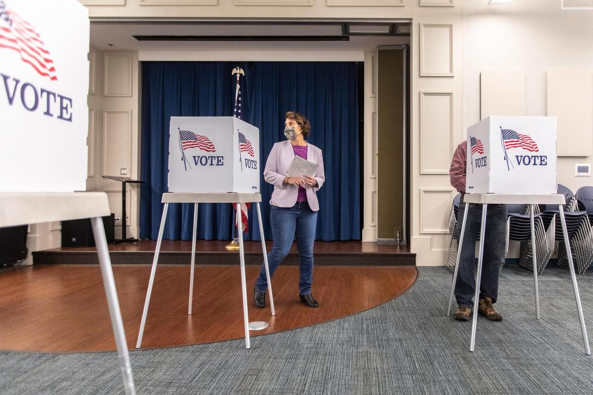 Amy McGrath, Kentucky Democratic candidate for the U.S. Senate, votes during early voting at the Scott County Public Library in Georgetown, Ky., on Tuesday, Oct. 13, 2020.