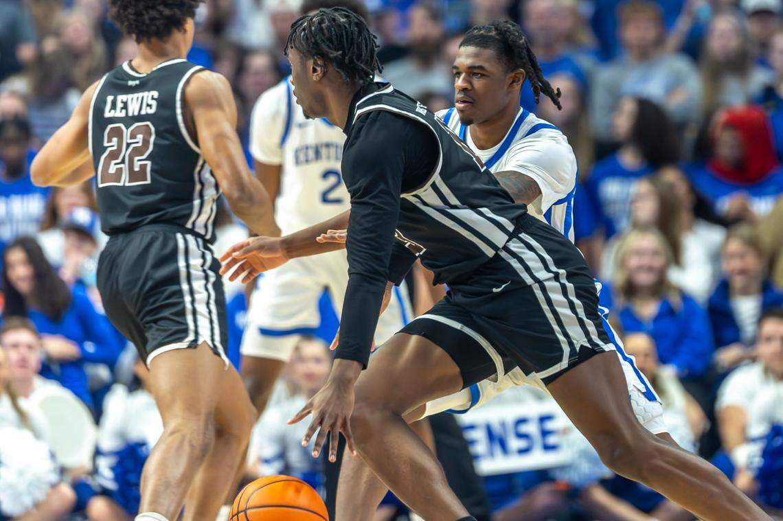 Brown guard Malcolm Wrisby-Jefferson (13) drives the ball as Kentucky guard Otega Oweh (00) defends during Tuesday’s game at Rupp Arena.