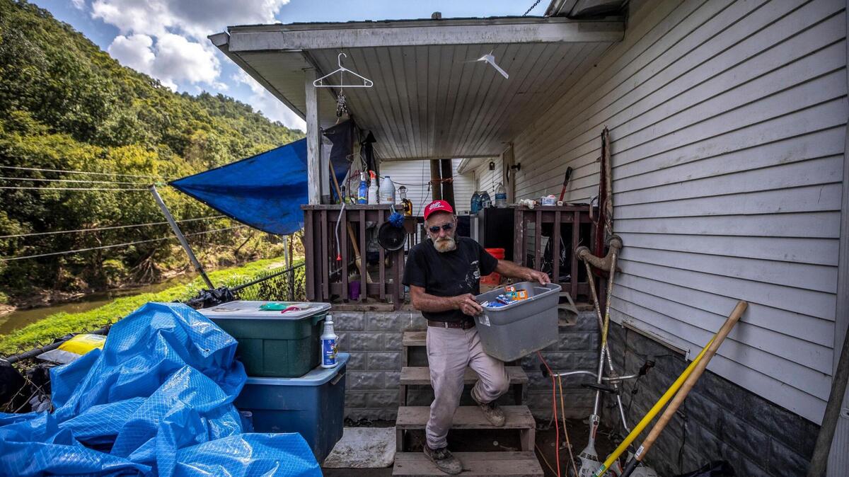 Jack Alsept, along with his wife, Sherry, are staying in tents at their flooded house in Perry County, Ky., as they work to clean and salvage what they can.