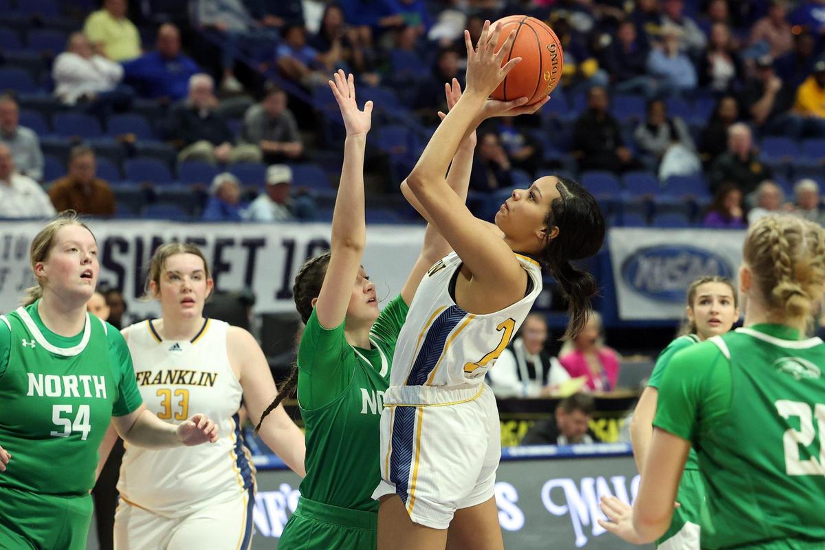 Franklin County’s Keyonna Taylor, right, shoots over North Laurel’s Mariella Claybrook during their opening-round game in Rupp Arena on Wednesday night. Taylor finished with 12 points, six rebounds and two blocks.