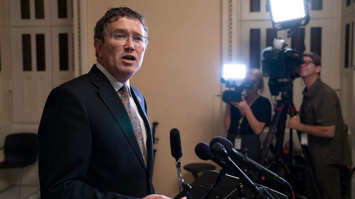 FILE - In this Tuesday, May 28, 2019 file photo, Rep. Thomas Massie, R-Ky., speaks to reporters at the Capitol after he blocked a unanimous consent vote on a long-awaited $19 billion disaster aid bill in the chamber. Todd McMurtry, an attorney who represented a Kentucky student embroiled in media lawsuits after a viral encounter with a Native American activist, stepped forward Friday, Jan. 10, 2020 to challenge U.S. Rep. Thomas Massie, setting up an intraparty fight in a solidly Republican congressional district. (AP Photo/J. Scott Applewhite, File)
