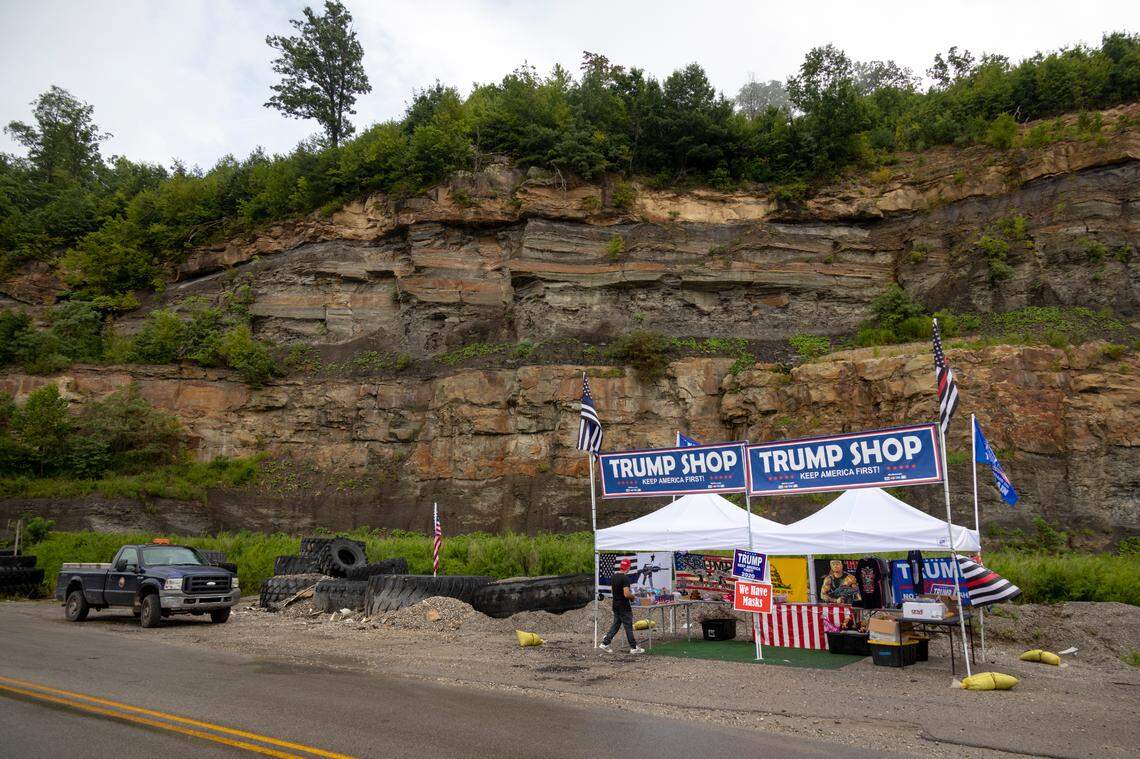 Fabio Ferreira, of Florida, sells merchandise supporting President Trump in Hazard, Ky., on Friday, August 21, 2020.