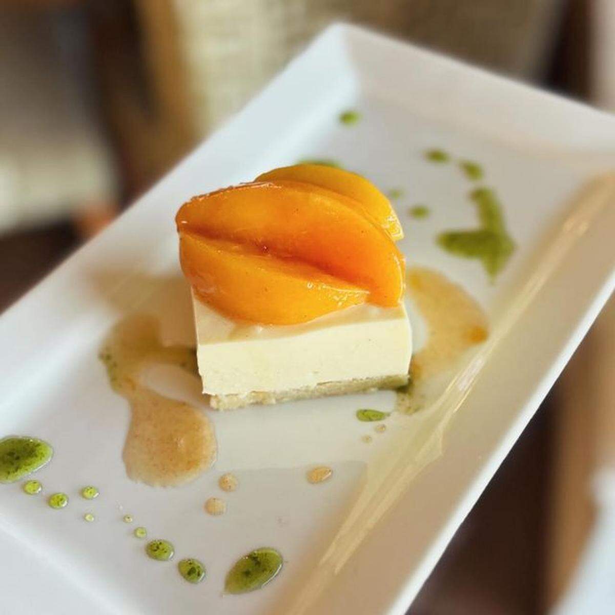 Goat Cheese Bavarois with cinnamon peach conserve, almond shortbread and candied basil syrup from Bella Cafe & Grille.